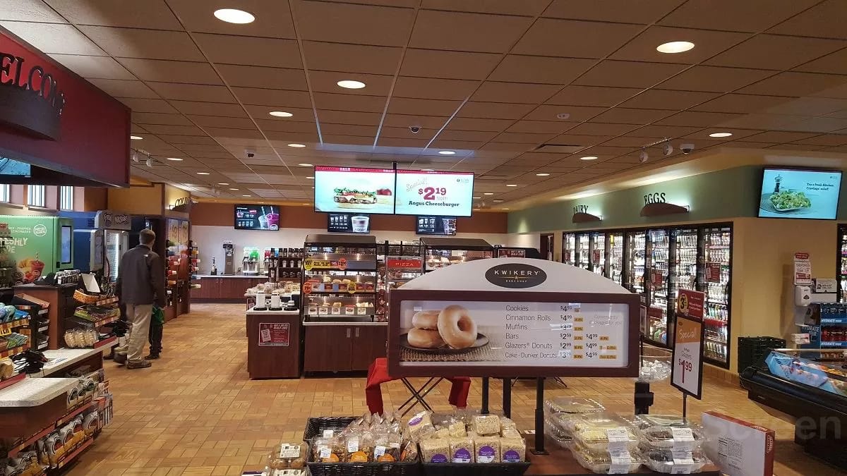 gas station digital signage inform consumers with store ads and gas price signs